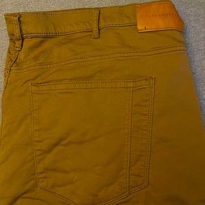 Perry ellis gold colored chinos.